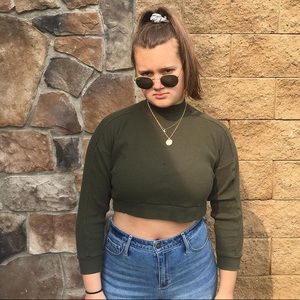 high neck, cropped, olive green sweater.